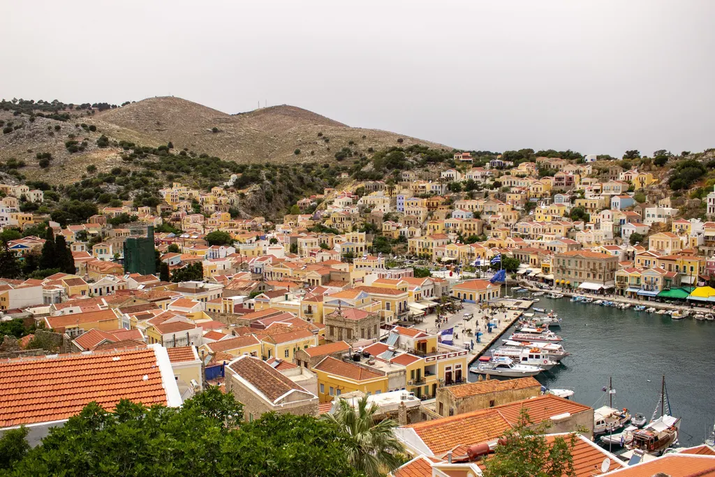 The harbour of Symi with colourful neoclassical houses climbing the hillside